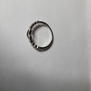 9.25 sterling silver open heart ring with a beaded or stone-accented band